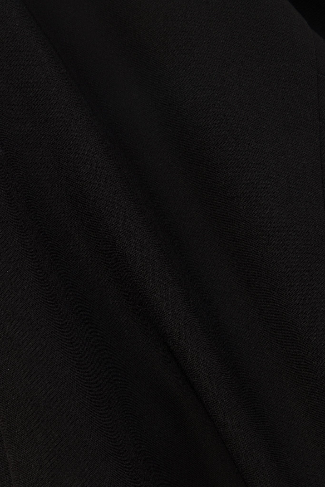 Close-up of Hero Scrubs Black scrub fabric showing the smooth finish
