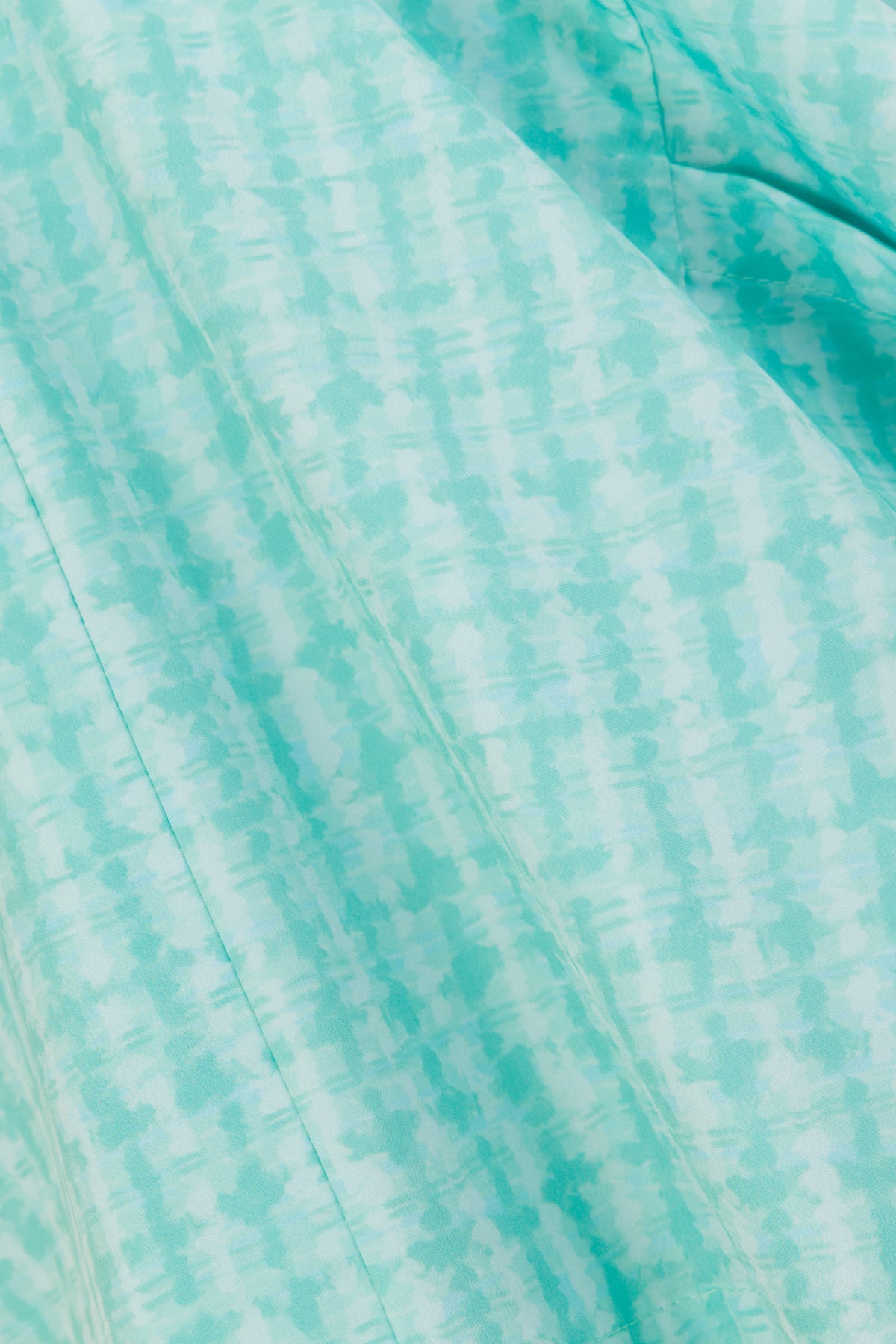 Close-up of Hero Scrubs Mint printed scrub fabric